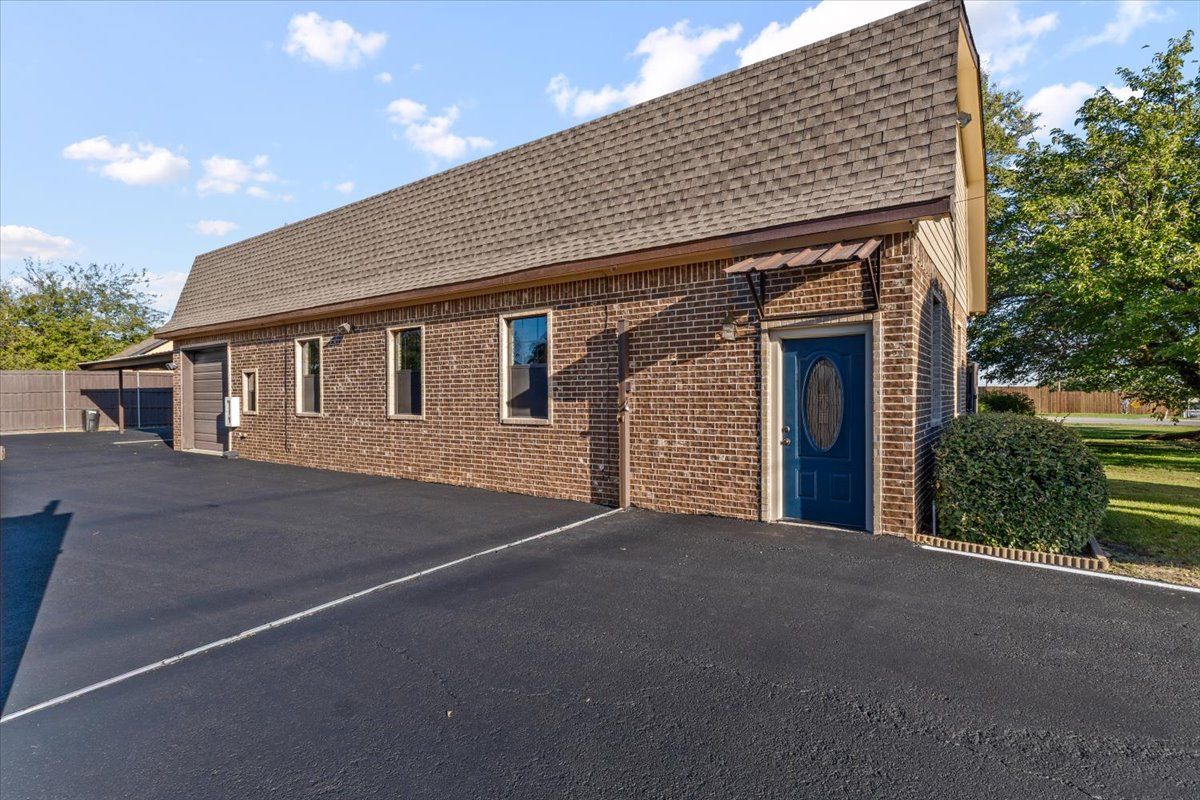 Brick exterior with blue entry door