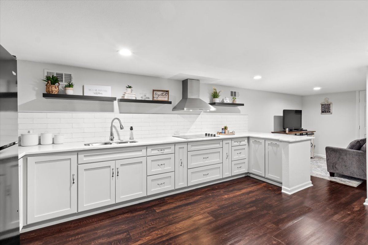 Second-floor kitchen with white shaker cabinets