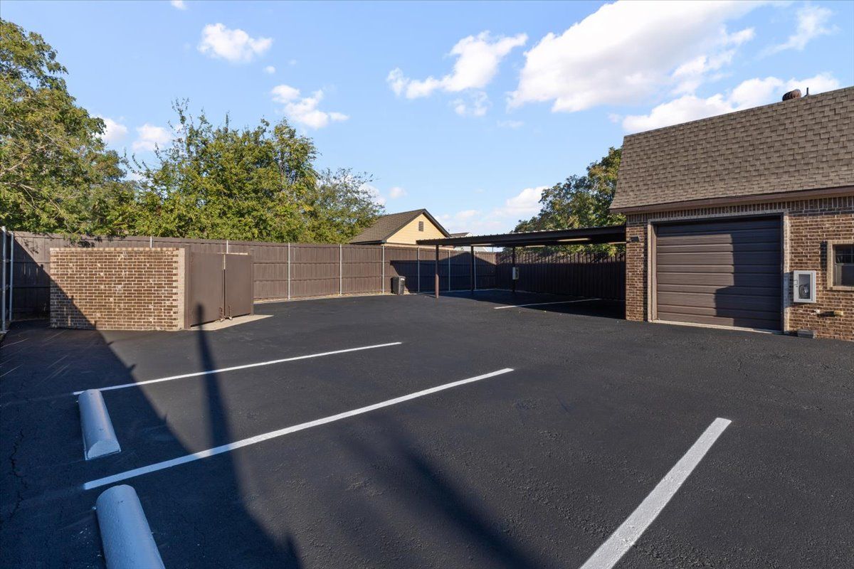 Rear lot with carport and garage door