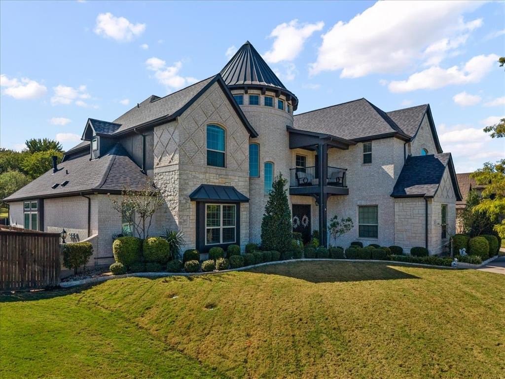 Front of the home with its stone turret