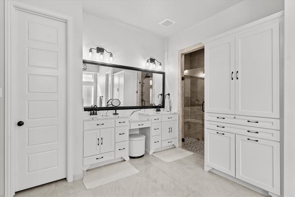 Primary bath vanity and walk-in shower
