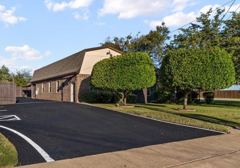 Brick office building at 207 N Tarrant Street in downtown Crowley